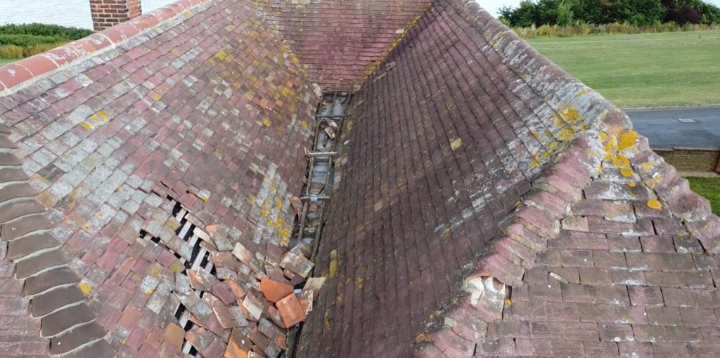 A drone allows us to get to parts of the roof not easily accessible to provide a birds eye view of the condition - seen here extensive damage - requiring a quote prior to exchange of contracts which saved the buyer £'000s of pounds